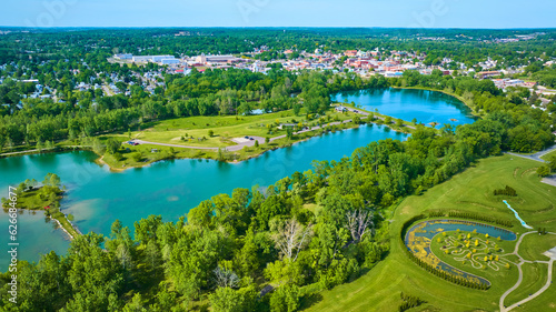 Distant city of Mount Vernon Ohio in aerial of large lake and island at Ariel Foundation Park trails