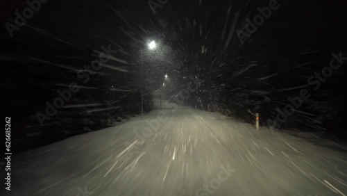 On a night winter road in a snow storm