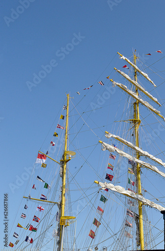 Flags and masts on a  sailing ship