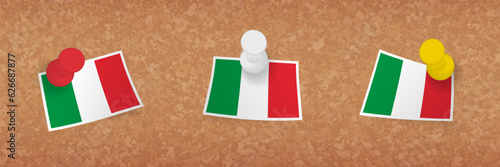 Italy flag pinned in cork board, three versions of Italy flag.