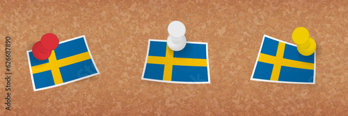 Sweden flag pinned in cork board, three versions of Sweden flag.