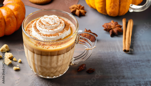 Fototapeta Naklejka Na Ścianę i Meble -  Pumpkin spice latte in a glass mug with cinnamon, nutmeg and cookies