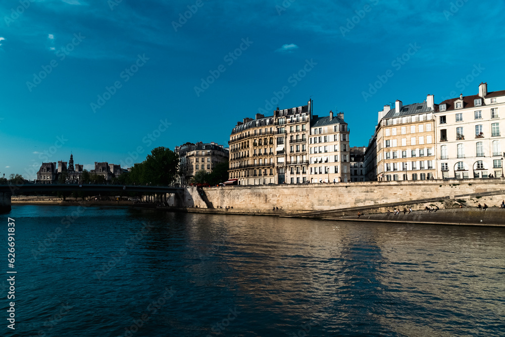 Paris, France. April 24, 2022: City architecture with houses and Seine river view