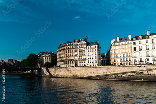 Paris, France. April 24, 2022: City architecture with houses and Seine river view