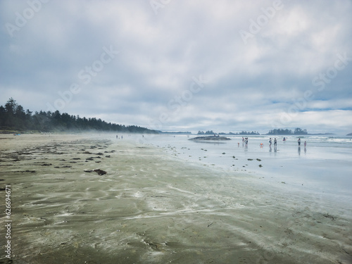 People at tofino, long beach, british colombia during summer time.