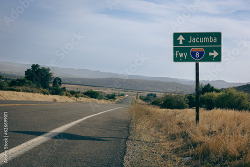 Jacumba and Freeway 8 sign on an empty Californian desert road