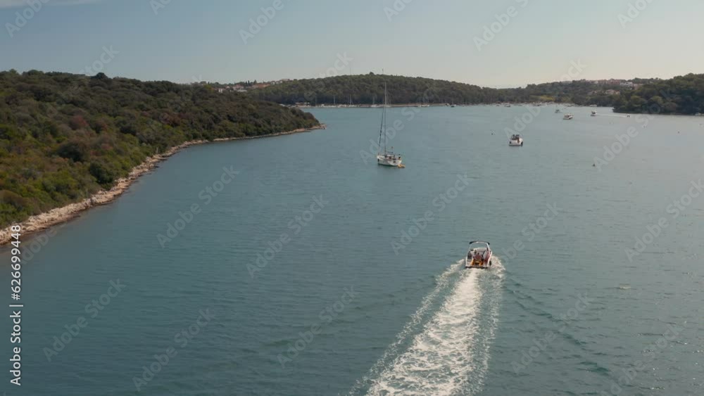 Drone aerial view of Mediterranean sea view with boats in a bay Drone aerial view of Mediterranean sea view with boats in a bay
