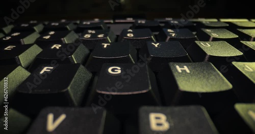 Computer kayboard closeup in the dark photo