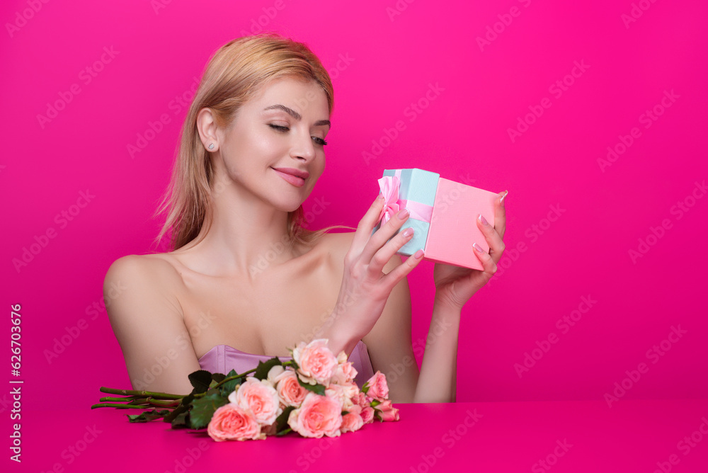 Gifts and presents. Woman receiving holiday surprise, celebrating holidays with gift. Beautiful woman with gift. Beauty model with gift celebrate christmas or new year. Holiday gift and party. Gifts and presents. Woman receiving holiday surprise, celebrating holidays with gift. Beautiful woman with gift. Beauty model with gift celebrate christmas or new year. Holiday gift and party.