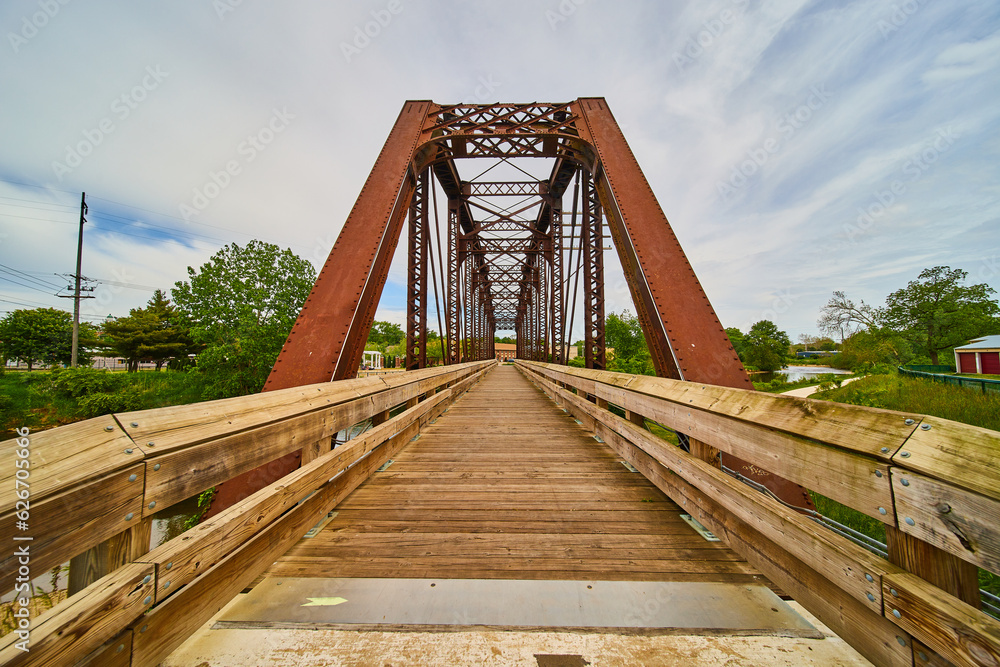 Entrance to walking bridge converted from old rusty railway train track bridge in Mount Vernon