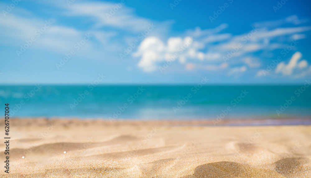 Abstract blur defocused background. Tropical summer beach with golden sand, turquoise ocean and blue sky with white clouds on bright sunny day. Colorful landscape for summer holidays. Abstract blur defocused background. Tropical summer beach with golden sand, turquoise ocean and blue sky with white clouds on bright sunny day. Colorful landscape for summer holidays.