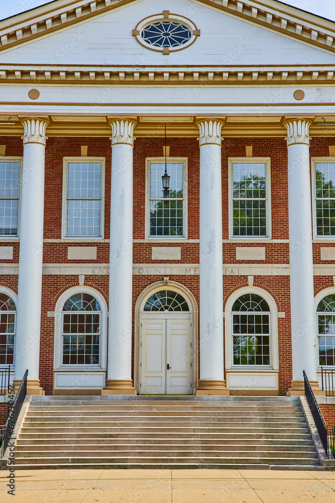 Red brick building with tall white pillars and steps to entrance Knox County Memorial