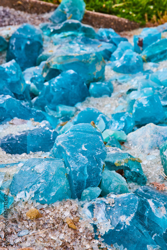 Fantastical colors of blue glass ranging from tiny pebbles to boulder sized chunks