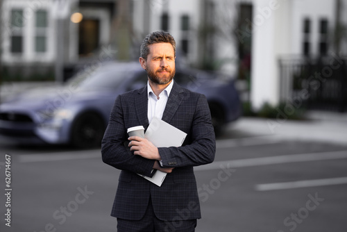 Businessman leaving office. Businessman walking home from work. Businessman working late. Businessman after success office work. End of business day. Successful business man in business suit outdoor.