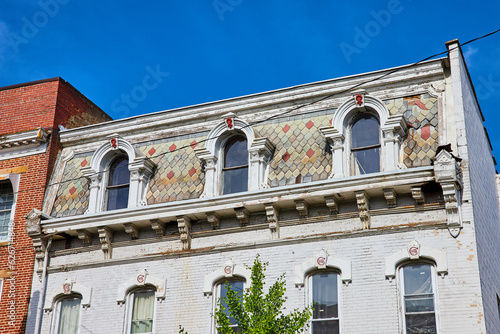 Unique colorful tile siding on white brick roof building in Public Square Mount Vernon Ohio photo