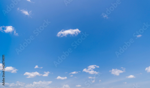  Panoramic view of clear blue sky and clouds  Blue sky background with tiny clouds. White fluffy clouds in the blue sky.