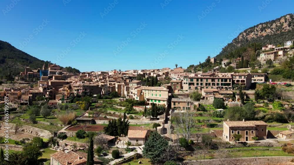 Slow aerial drone reveal of historic Deia Village on span ish tropical island Mallorca Slow aerial drone reveal of historic Deia Village on span ish tropical island Mallorca