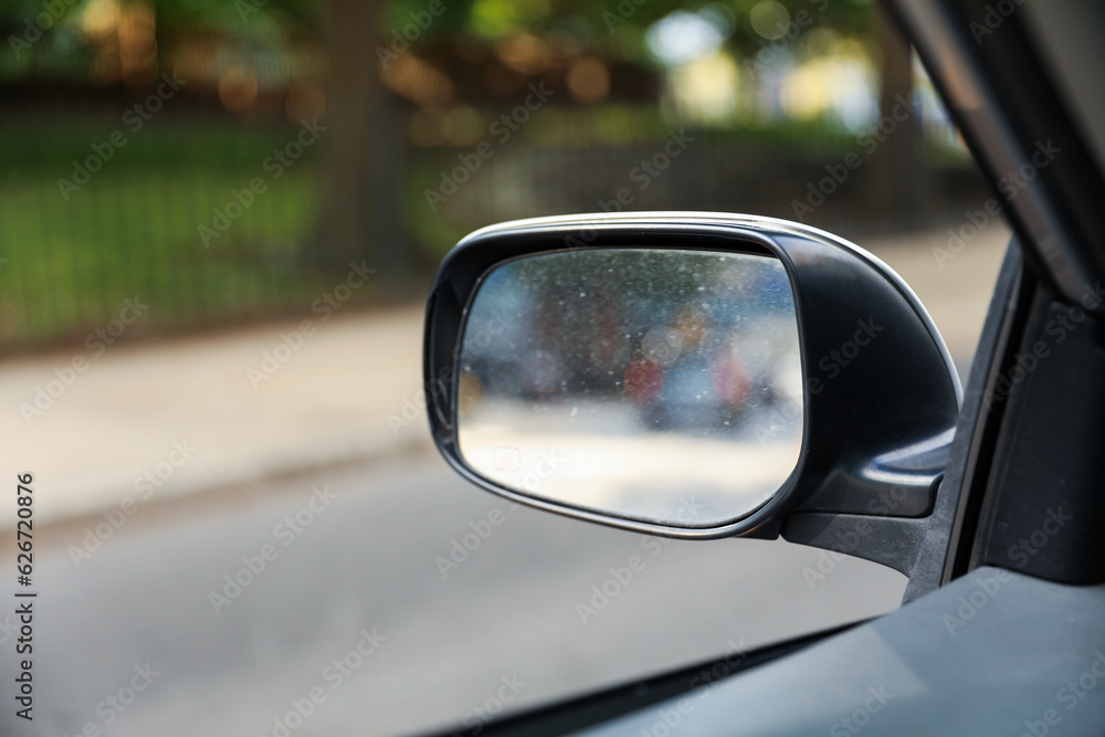 Car mirror reflects life's journey, symbolizing reflection, hindsight, self-awareness, and the road ahead. Metaphor for introspection