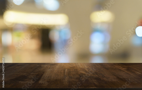 Empty wood table top and blur of out door garden background Empty wooden table space for text marketing promotion. blank wood table copy space for background © Charlie's