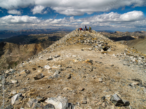 Group Of Climbers Atop a 14er Mountain in Colorado photo