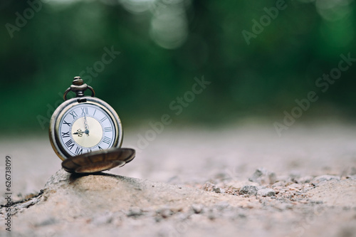close up pocket watch on stone, nature copy space background, planning and manage to success business concept