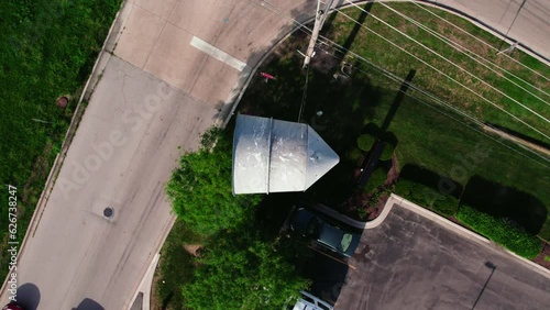 top down aerial of Emergency natural disaster Siren. Seek shelter when activated. Horn pole for population of the city about emergency situations. Plainfield Illinois USA - Drone Aerial 4k photo