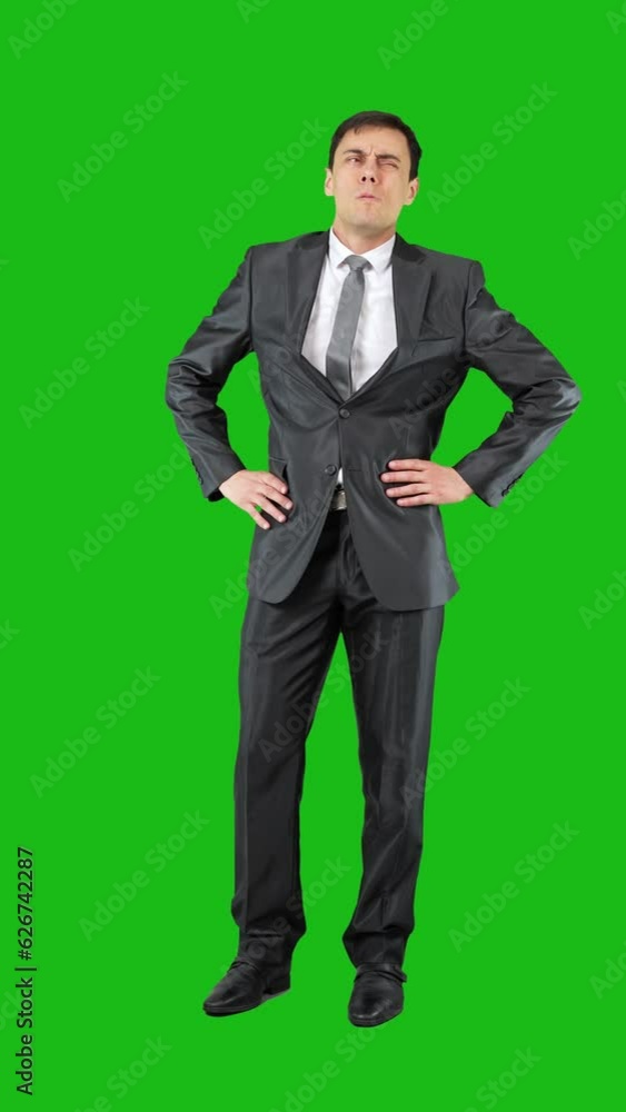 Unsure businessman in suit thinking in studio. Chroma key Unsure businessman in suit thinking in studio. Chroma key
