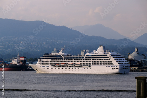 Luxury cruiseship cruise ship liner Regatta sail away departure from Vancouver, British Columbia to Alaska with beautiful nature landscape coast scenery bridge travel adventure