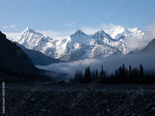 Snow-capped mountains above the morning mist