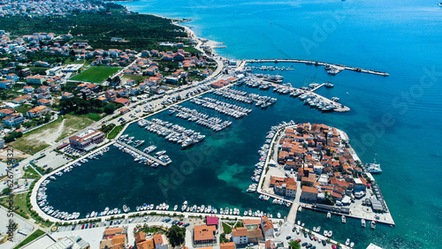 Old city at the sea coast. Croatia Tribunj. Aerial drone view. photo