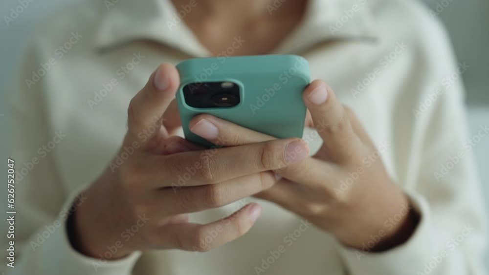 Hand of Asian beautiful teenager girl using texting mobile phone or chat