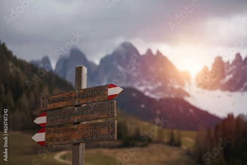 Sign for hiking trails in the Dolomites. Signpost on a hiking trail in the Alps. photo