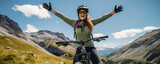 Happy woman with open arms on bike high in mountains.