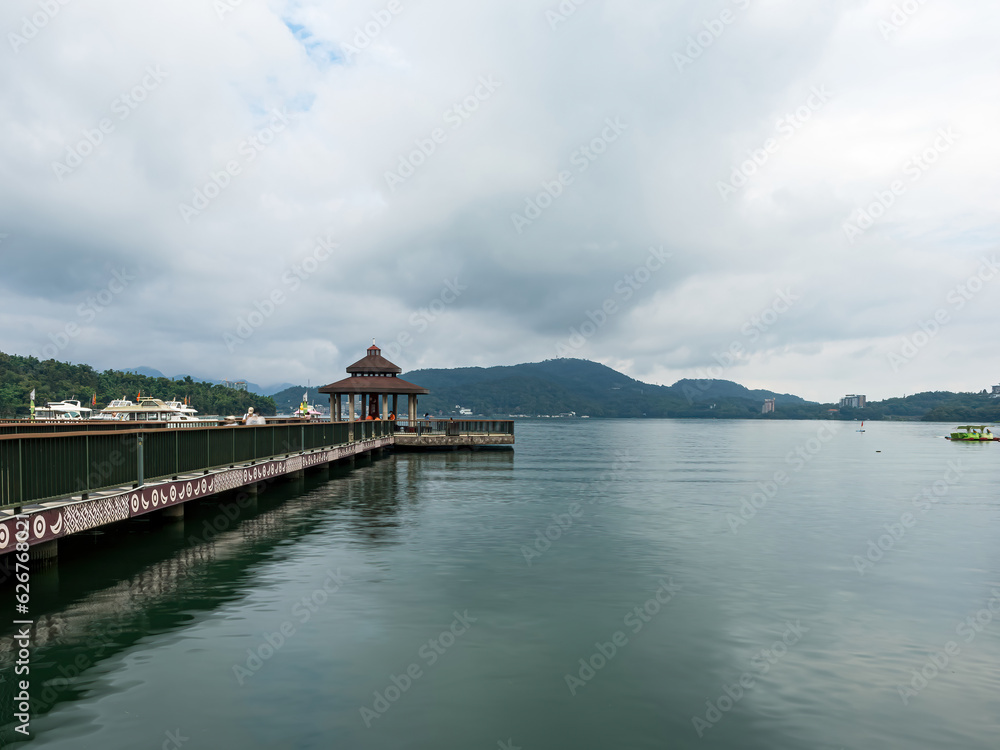 SUN MOON LAKE,TAIWAN - JUNE 10: many boats parking at the pier on June 10, 2023 at Sun Moon Lake, Taiwan. Sun Moon Lake is the largest body of water in Taiwan as well as a tourist attraction.