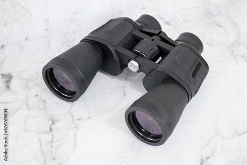 Binoculars on an isolated white background. Zoom binocular for astronomy observation or military 