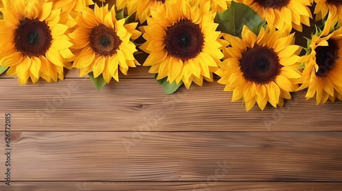 Sunflowers on the wooden background, flat lay, autumn banner.