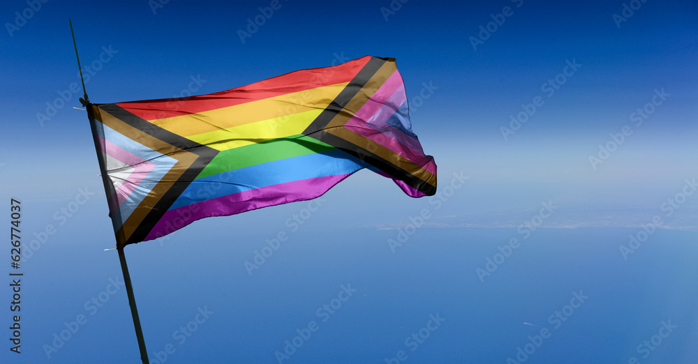 Bi Inclusive Unity flag waving in the wind at cloudy sky. Freedom and love concept. Pride month. activism, community and freedom Concept. Copy space Bi Inclusive Unity flag waving in the wind at cloudy sky. Freedom and love concept. Pride month. activism, community and freedom Concept. Copy space