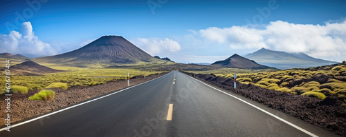 A long road leading towards to hight mountains. Journey concept, copy space for text. photo