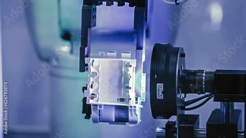 An industrial laser sensors are detecting electronic components.High-tech and industrial automation.