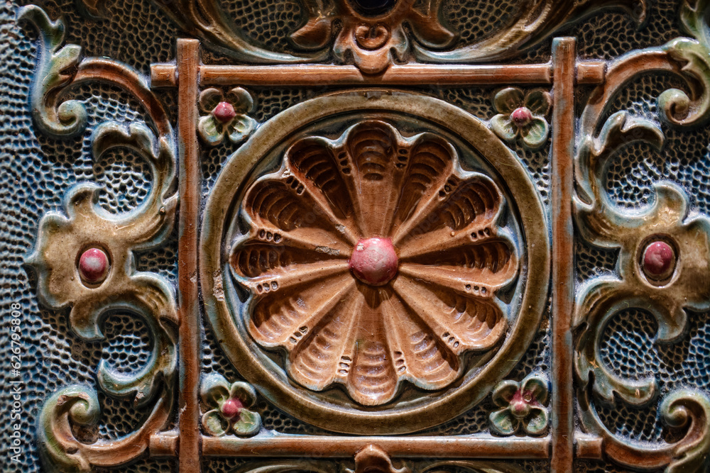 Closeup of ancient decorated furnace tile