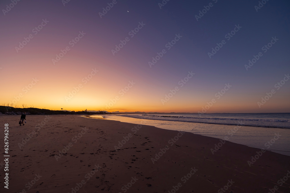 Sunset beach views across Main Beach in Byron Bay, New South Wales, Eastern Australia Sunset beach views across Main Beach in Byron Bay, New South Wales, Eastern Australia