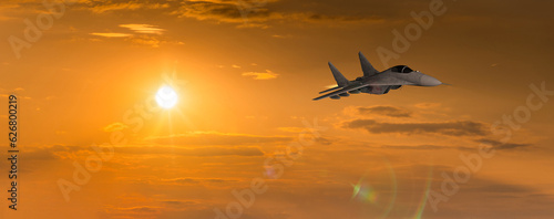 Combat aircraft MIG-29 against the backdrop of the sunset sky