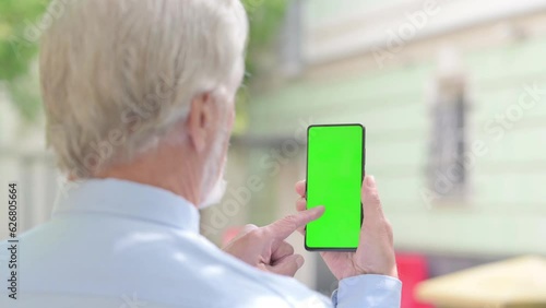 Senior Old Man Using Phone with Green Screen Outdoor