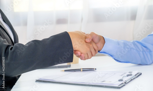 handshake after Office executives interviewing job applicants in the meeting room. employer conversation summary work employment