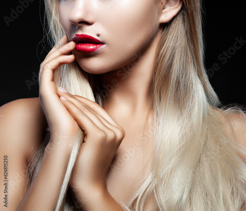 Beauty red lips, young woman face part with hand