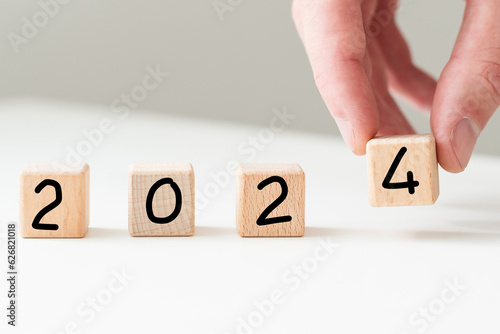 New year 2024 concept. business idea over wooden board