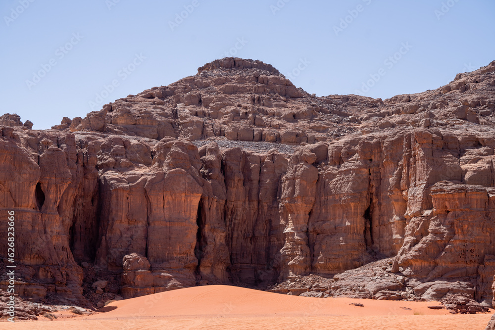 view in the Sahara desert of Tadrart rouge tassili najer in Djanet City ,Algeria.colorful orange sand, rocky mountains view in the Sahara desert of Tadrart rouge tassili najer in Djanet City ,Algeria.colorful orange sand, rocky mountains