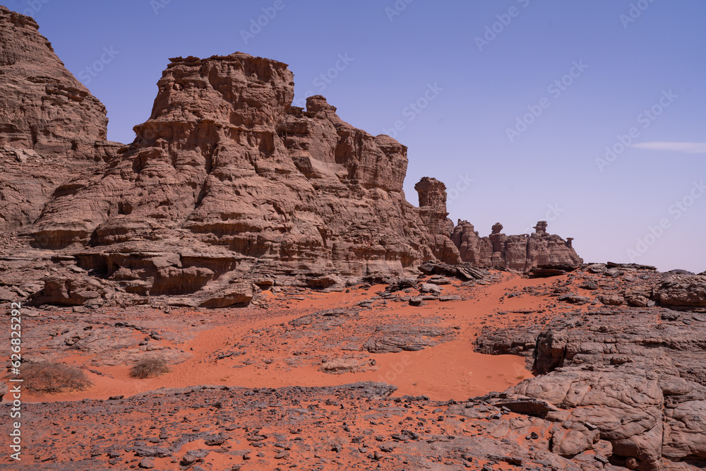 view in the Sahara desert of Tadrart rouge tassili najer in Djanet City ,Algeria.colorful orange sand, rocky mountains view in the Sahara desert of Tadrart rouge tassili najer in Djanet City ,Algeria.colorful orange sand, rocky mountains