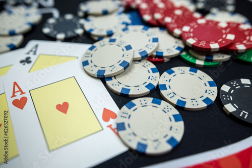 The winning combination is four aces cards and chips on casino table