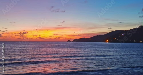 aerial view scenery reflection of beautiful sky on surfece water.Sunsets are often accompanied by colorful clouds..stunning red sunset over the sea. video 4K Nature video High quality footage. photo